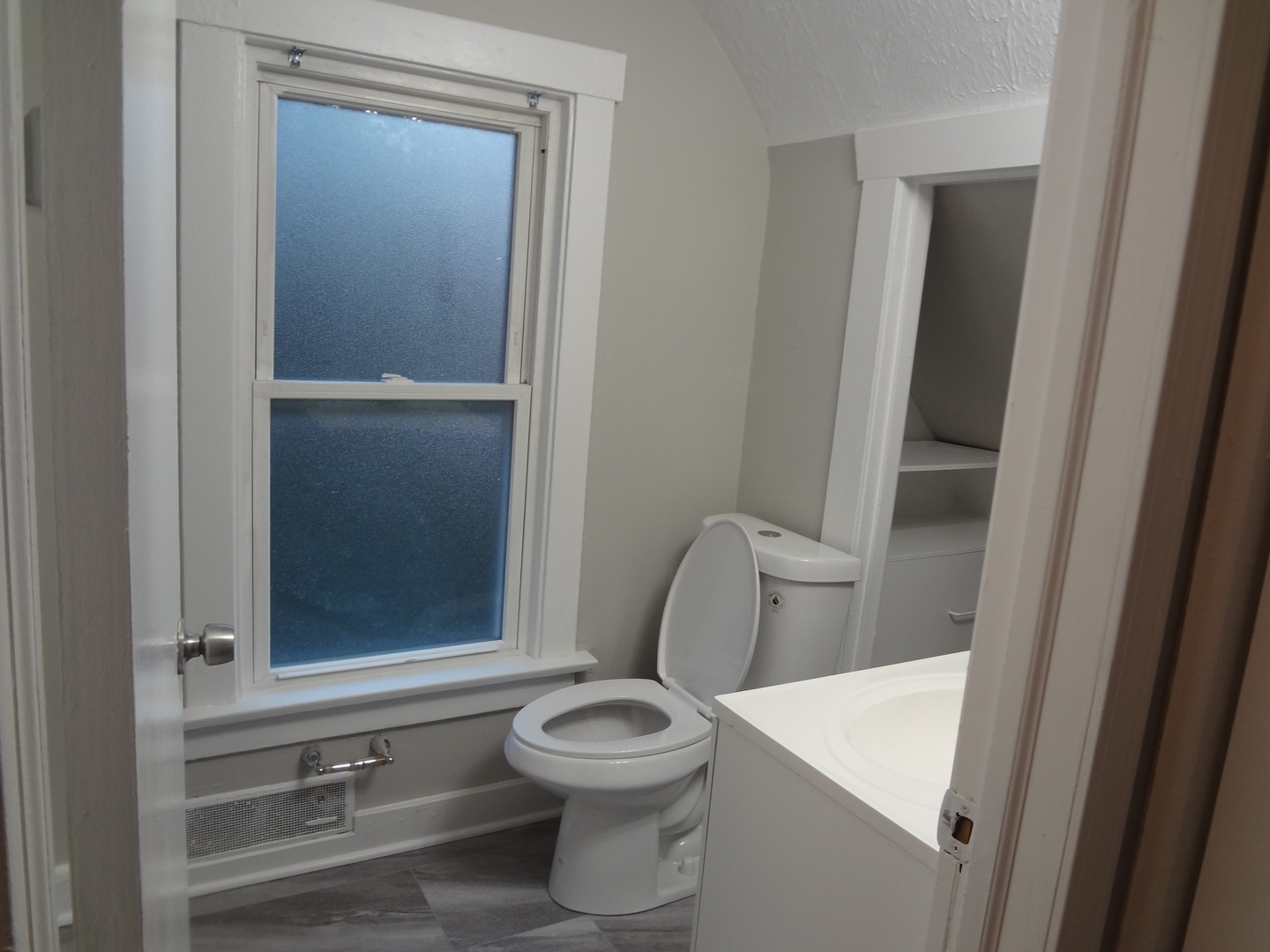 835 Oak Street Elgin, IL 60123 - Photo 34 of 45 a bathroom with a toilet and a sink