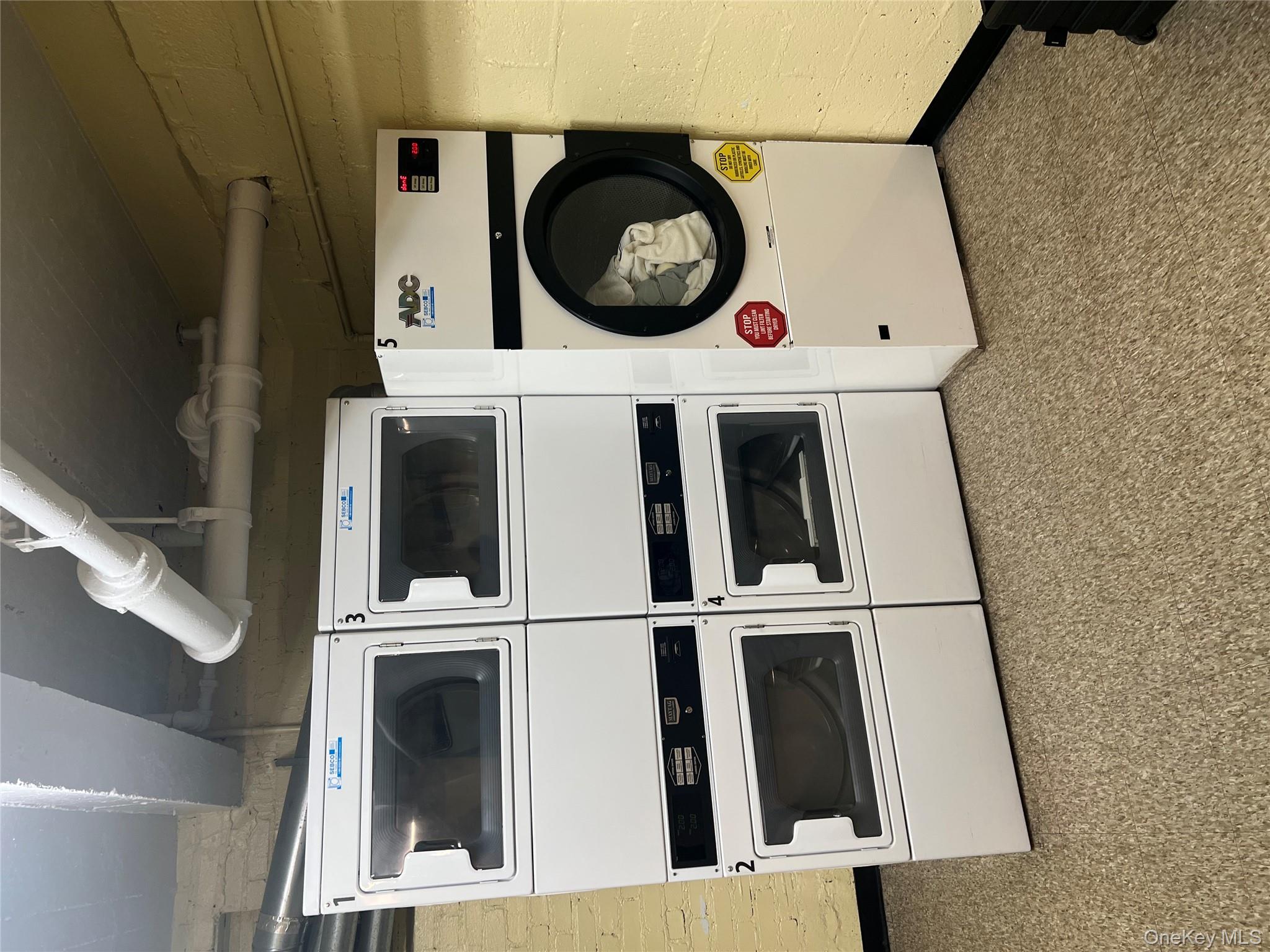 2080 Barnes Avenue, Unit 4C Bronx, NY 10462 - Photo 16 of 17 a utility room with dryer and washer