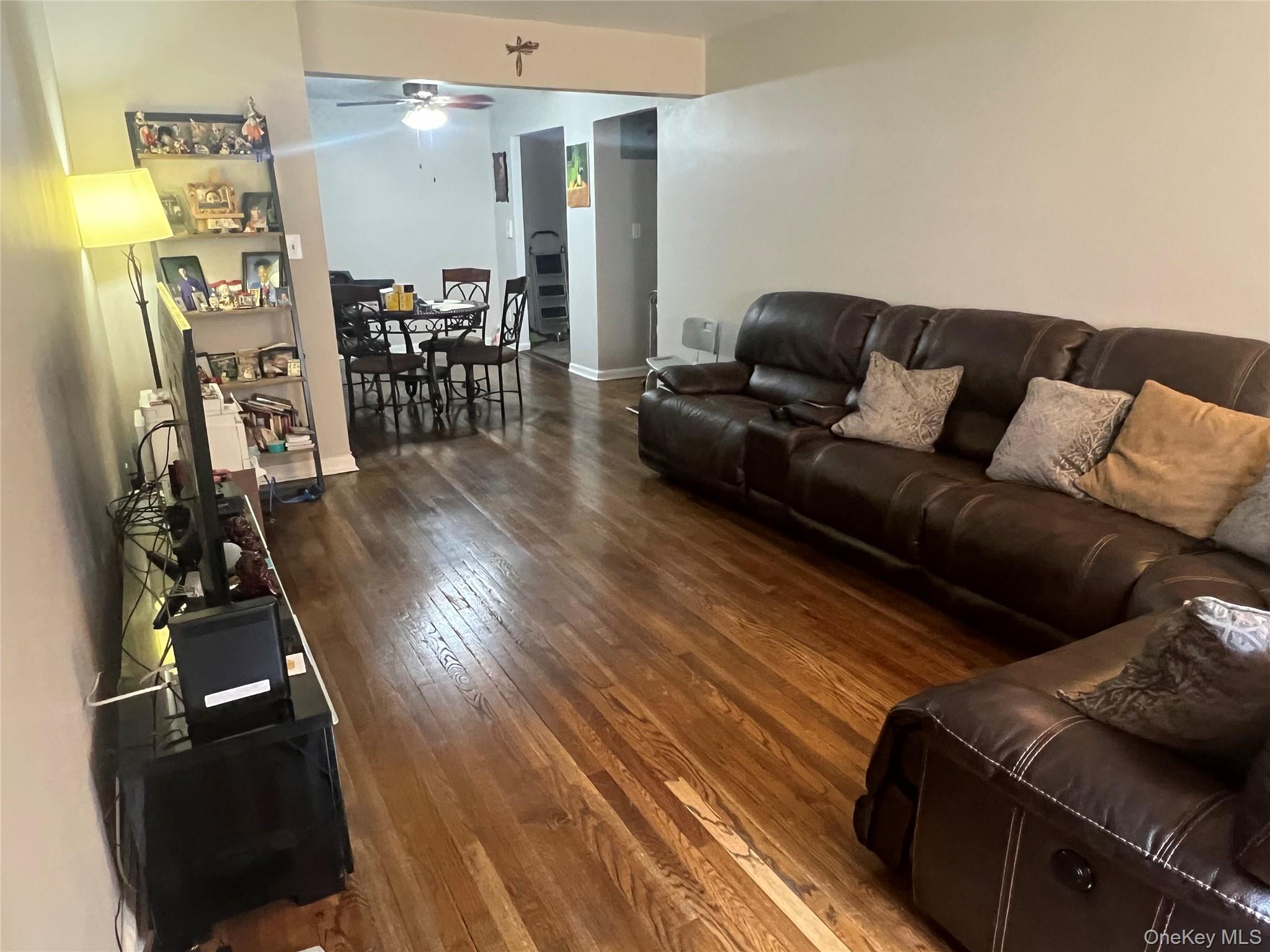 2080 Barnes Avenue, Unit 4C Bronx, NY 10462 - Photo 3 of 17 a living room with furniture and wooden floor