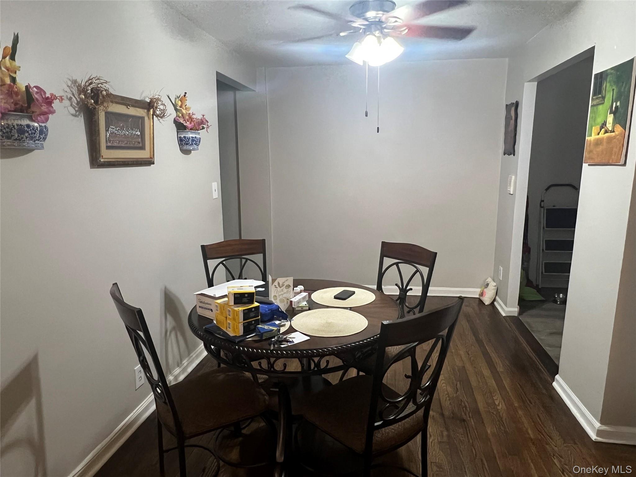 2080 Barnes Avenue, Unit 4C Bronx, NY 10462 - Photo 4 of 17 a view of a dining room with furniture and wooden floor