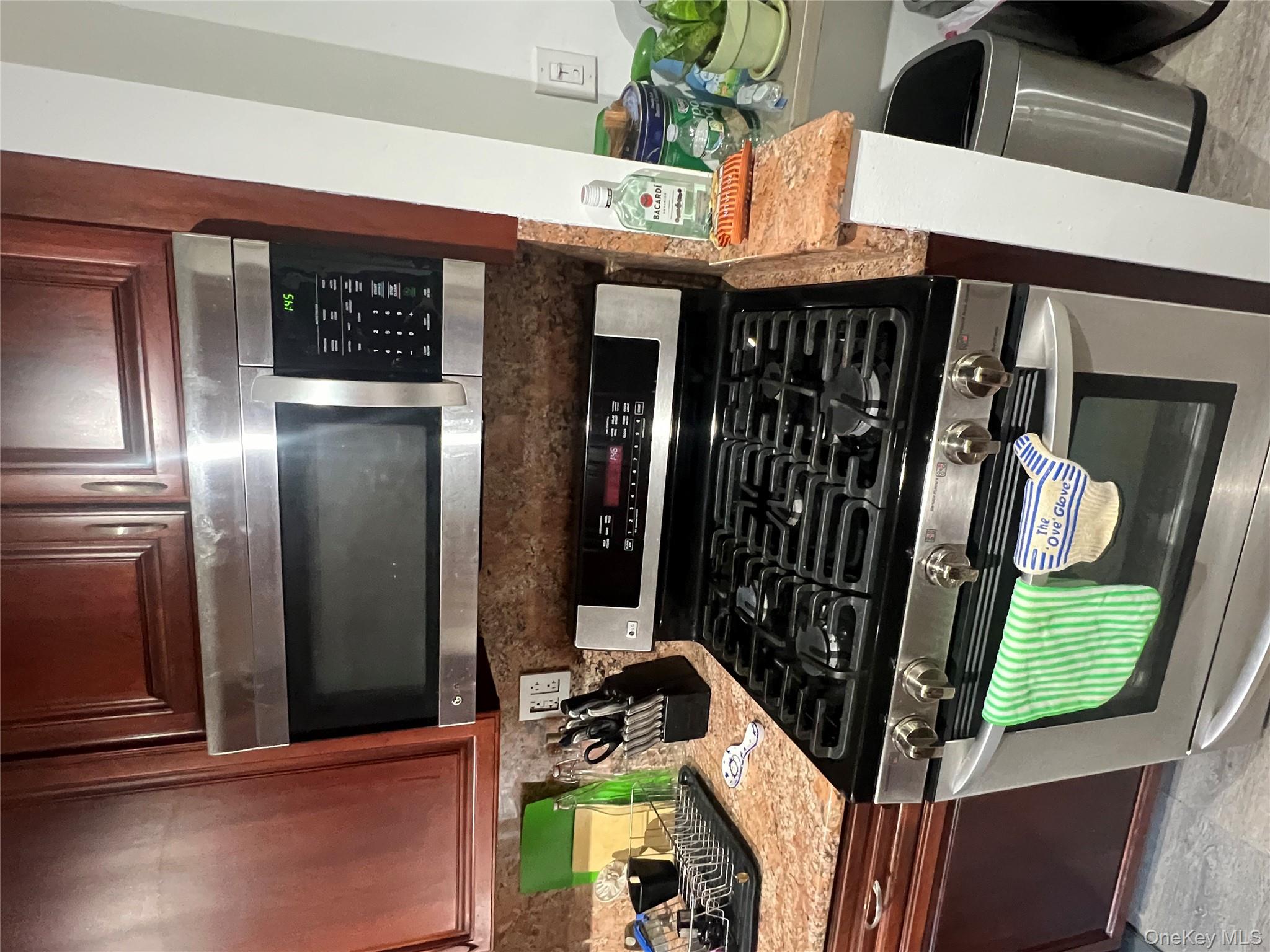 2080 Barnes Avenue, Unit 4C Bronx, NY 10462 - Photo 6 of 17 a stove top oven sitting inside of a kitchen
