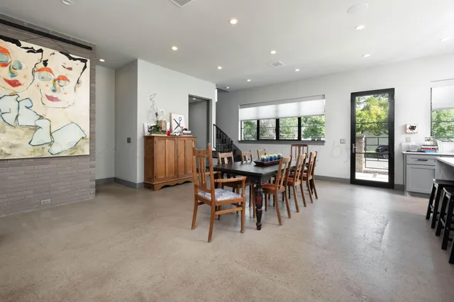 a kitchen with a stove a sink and a refrigerator