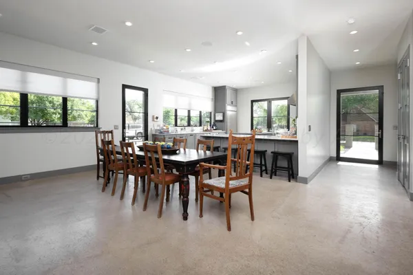 a kitchen with stainless steel appliances a stove a sink and a refrigerator