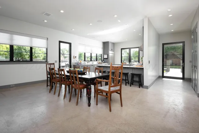 a kitchen with stainless steel appliances a stove a sink and a refrigerator