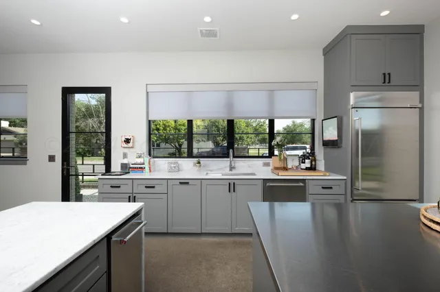 a bedroom with a bed and a tv on table