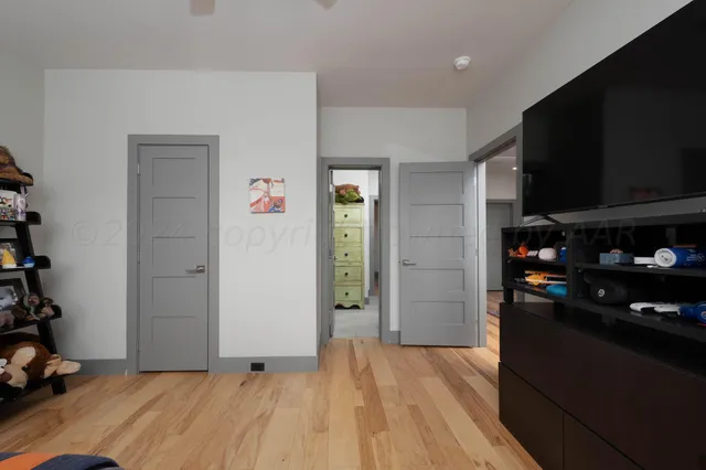 a view of a floor to ceiling window and a yard