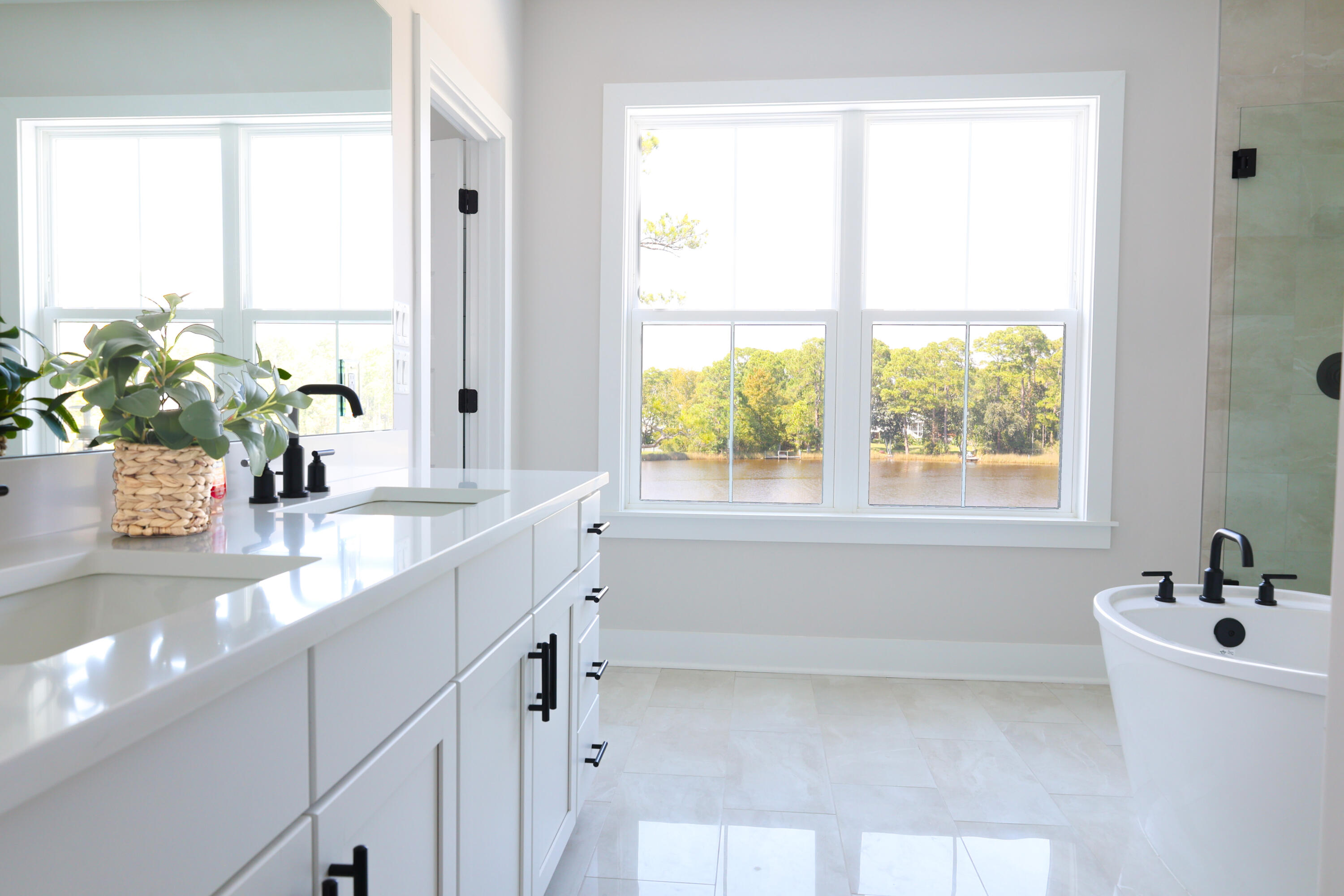 23 Tyler James Way Santa Rosa Beach, FL 32459 - Photo 3 of 47 a bathroom with a granite countertop sink and a large window