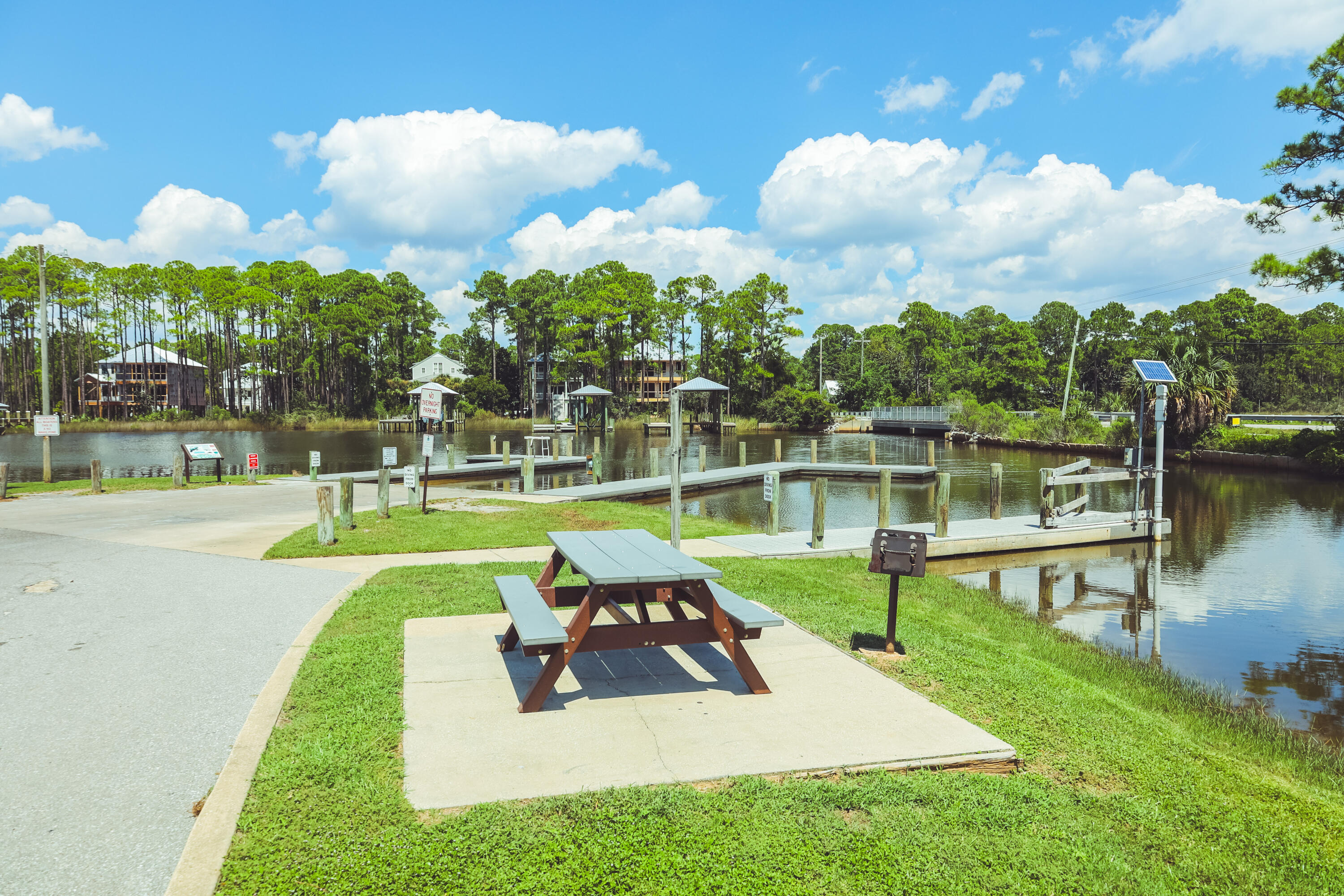 23 Tyler James Way Santa Rosa Beach, FL 32459 - Photo 31 of 47 a view of a park with houses slide and fire pit