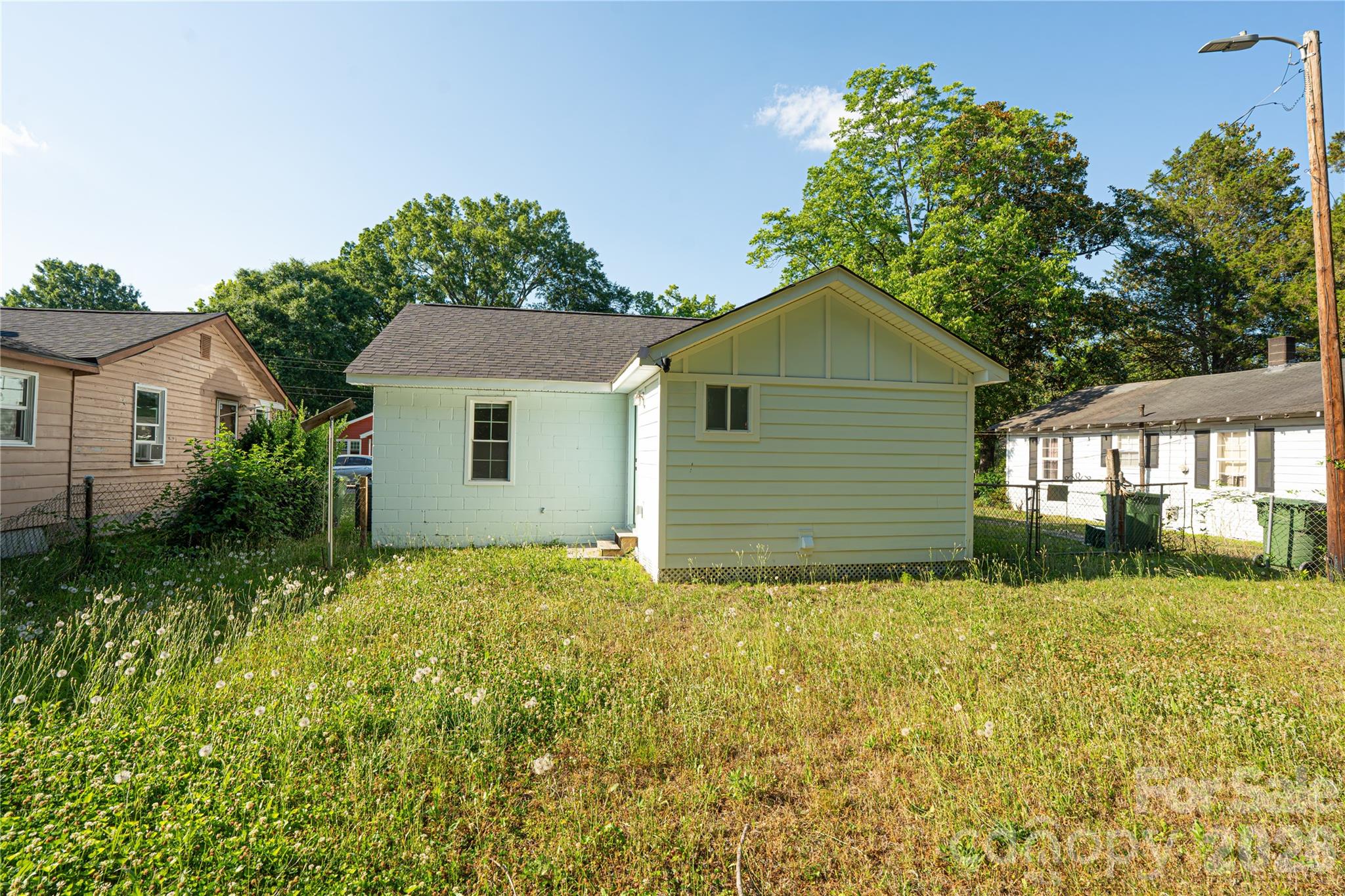 906 Gladstone Street Florence, SC 29501 - Photo 13 of 15 a view of a house with yard and a garden