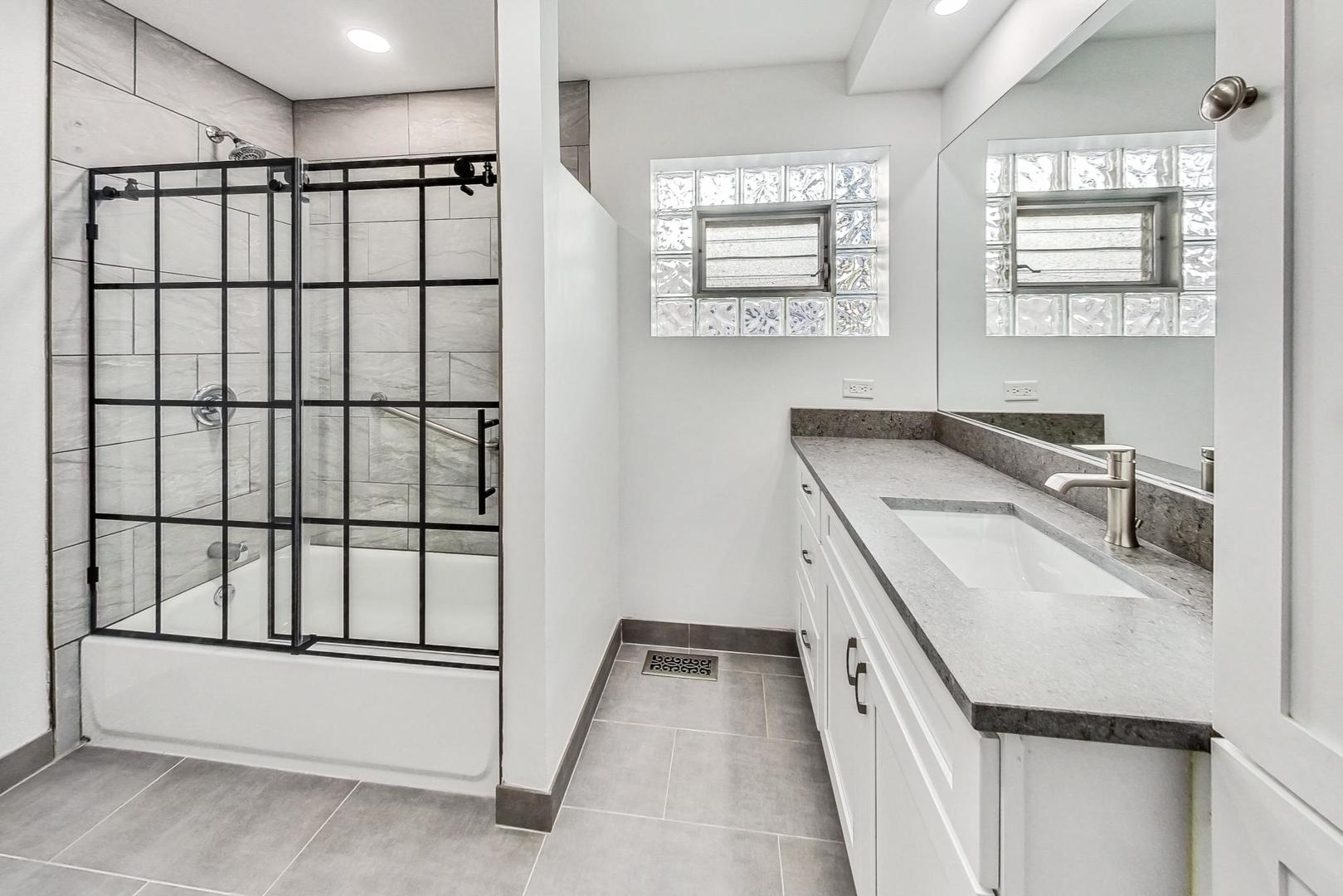 1108 Fortuna Avenue, Unit 1 Park Ridge, IL 60068 - Photo 15 of 39 a kitchen with a sink a window and cabinets
