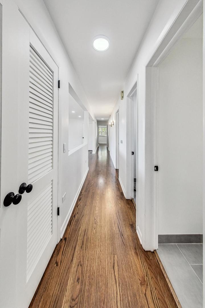 1108 Fortuna Avenue, Unit 1 Park Ridge, IL 60068 - Photo 16 of 39 a view of a hallway with wooden floor and staircase