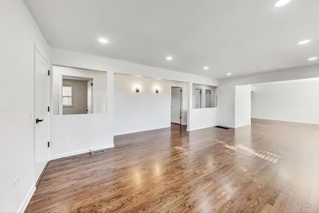 a view of a livingroom with wooden floor