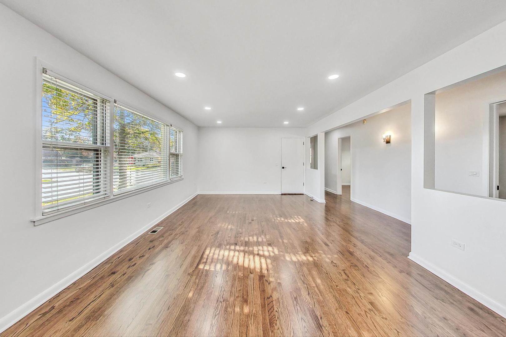1108 Fortuna Avenue, Unit 1 Park Ridge, IL 60068 - Photo 23 of 39 a view of empty room with wooden floor and fan