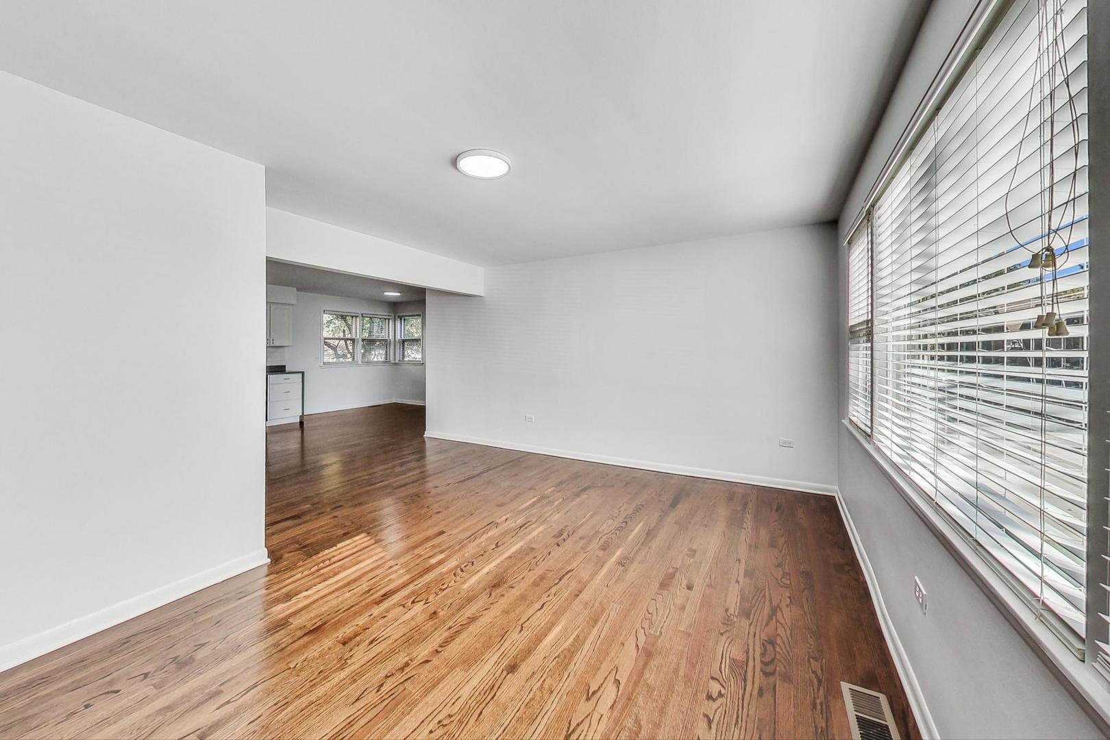 1108 Fortuna Avenue, Unit 1 Park Ridge, IL 60068 - Photo 25 of 39 a view of empty room with wooden floor and fan