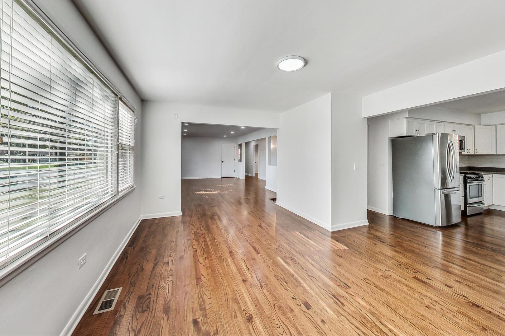 1108 Fortuna Avenue, Unit 1 Park Ridge, IL 60068 - Photo 26 of 39 a view of empty room with wooden floor and fan
