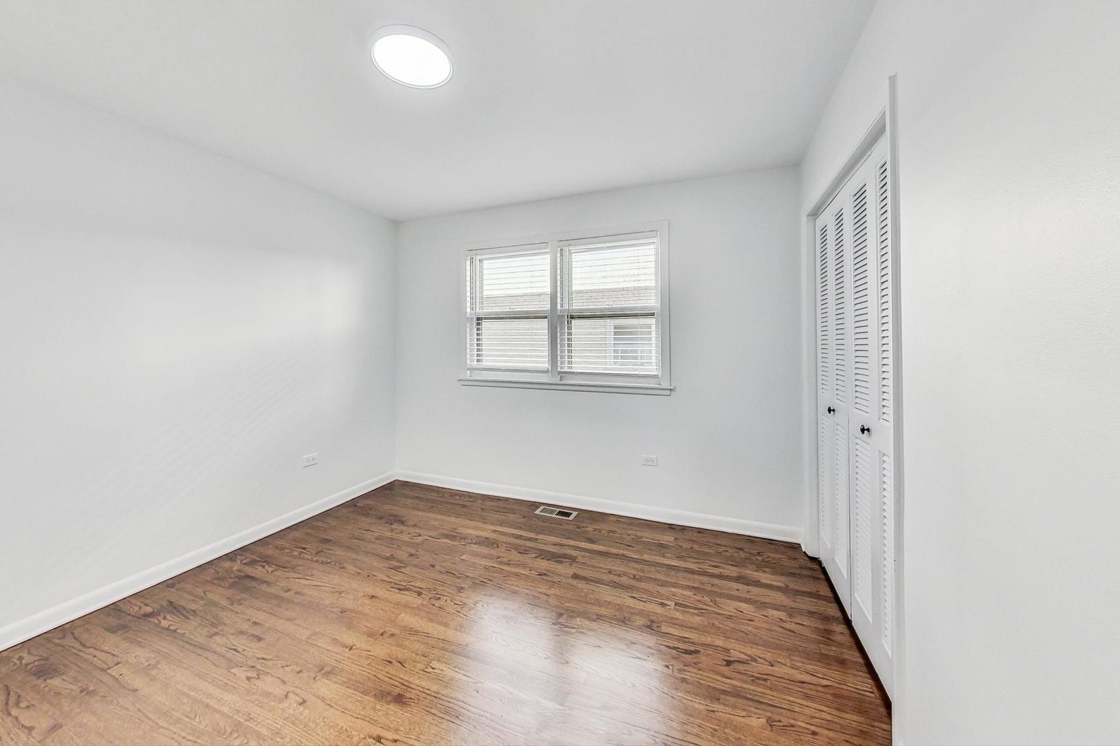 1108 Fortuna Avenue, Unit 1 Park Ridge, IL 60068 - Photo 30 of 39 an empty room with windows