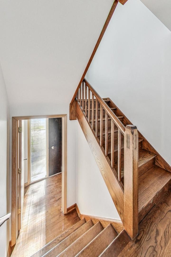 1108 Fortuna Avenue, Unit 1 Park Ridge, IL 60068 - Photo 3 of 39 a view of staircase with lots of windows and white walls