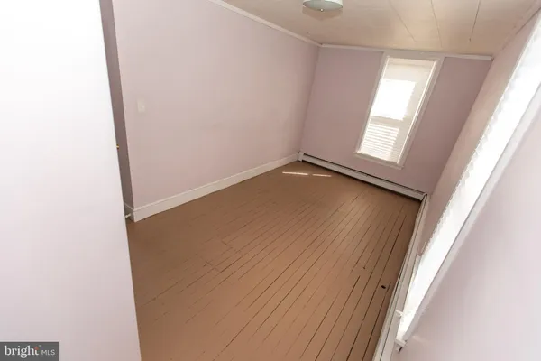 an empty room with a windows