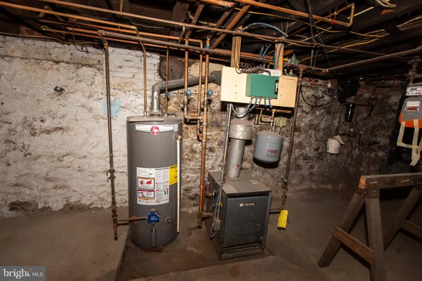 a utility room with lots of wooden furniture