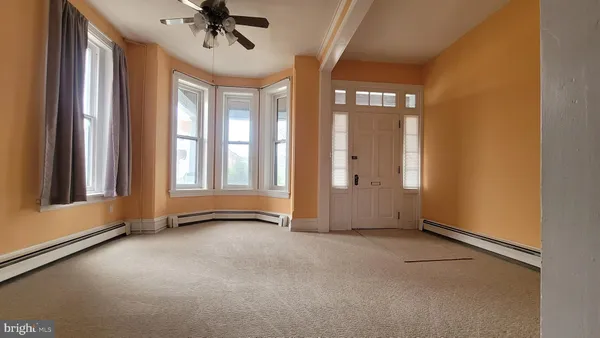 a view of an empty room with a window