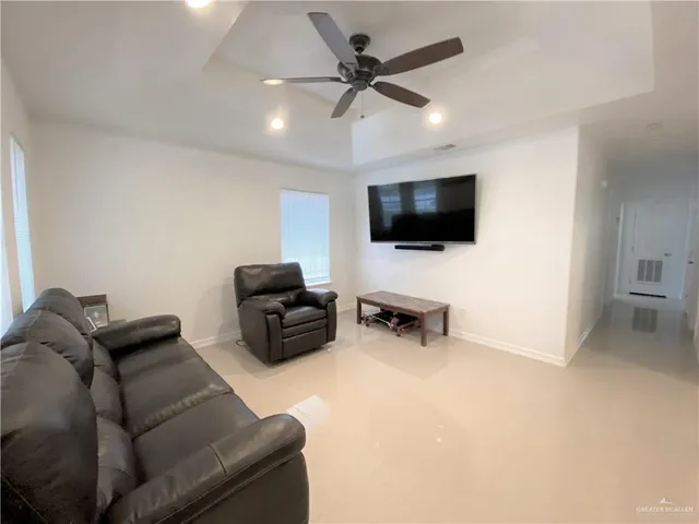 a kitchen with stainless steel appliances kitchen island granite countertop a sink and cabinets