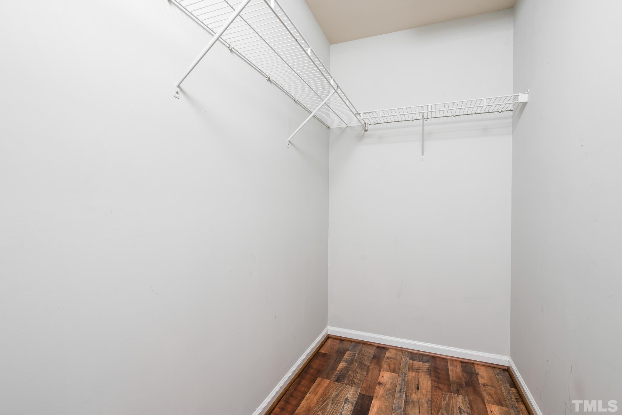 7814 Averette Field Drive Raleigh, NC 27616 - Photo 15 of 24 a view of a room with racks on the wall