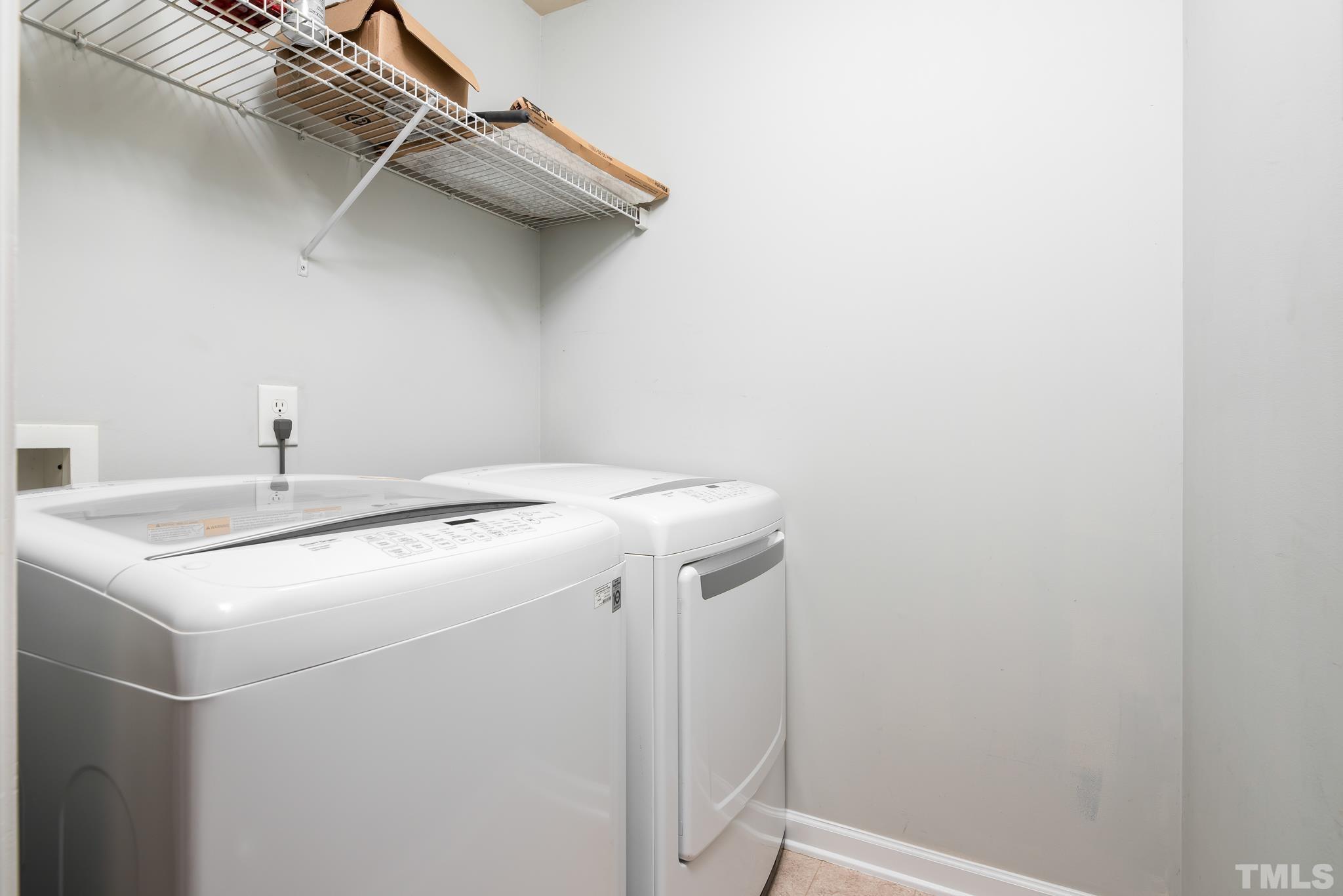 7814 Averette Field Drive Raleigh, NC 27616 - Photo 20 of 24 a utility room with dryer and washer