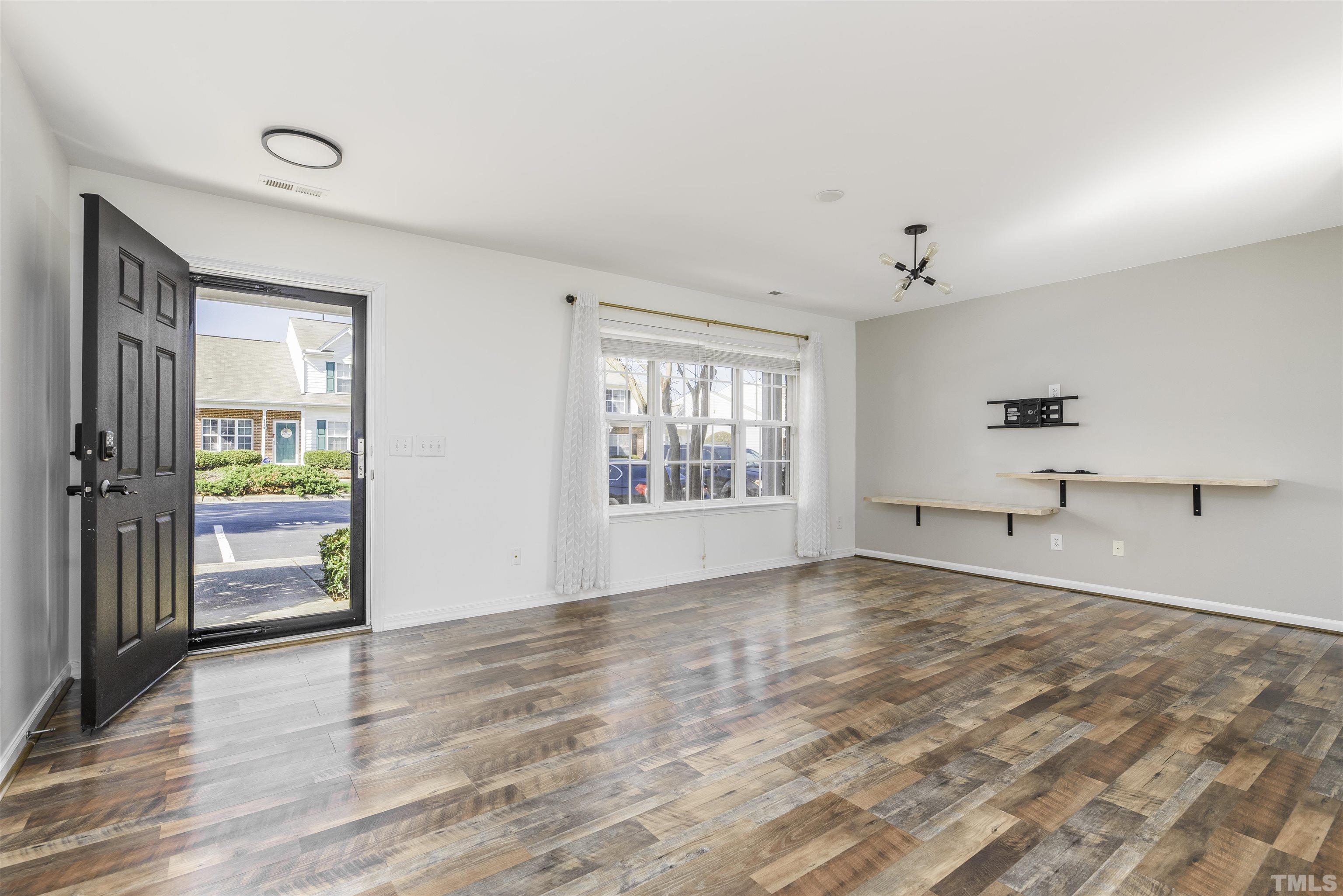 7814 Averette Field Drive Raleigh, NC 27616 - Photo 3 of 24 a view of an empty room with a window
