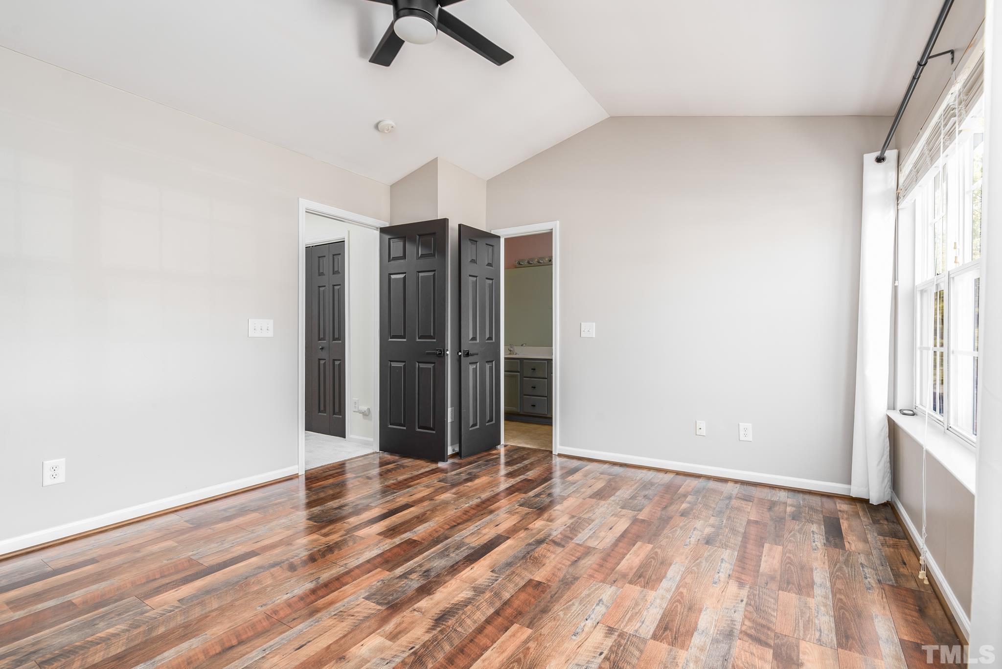 7814 Averette Field Drive Raleigh, NC 27616 - Photo 4 of 24 wooden floor in an empty room with a window