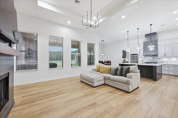 a view of a dining room with furniture and window