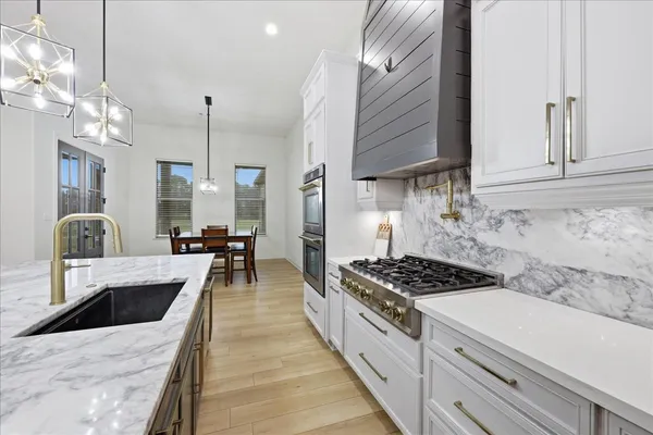 a view of hallway with a flat screen tv