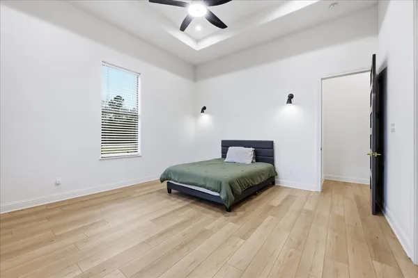 a bathroom with a double vanity sink mirror and bathtub