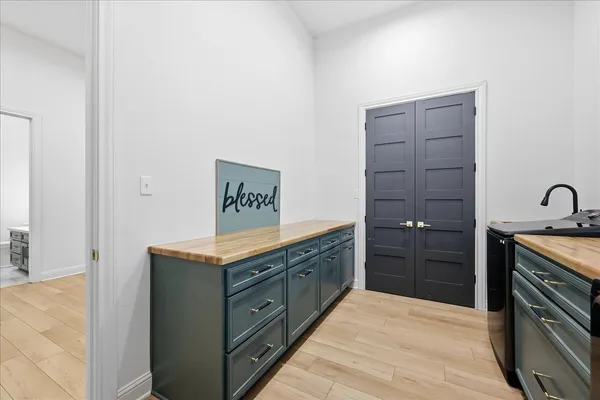 a view of a house with a yard and pathway