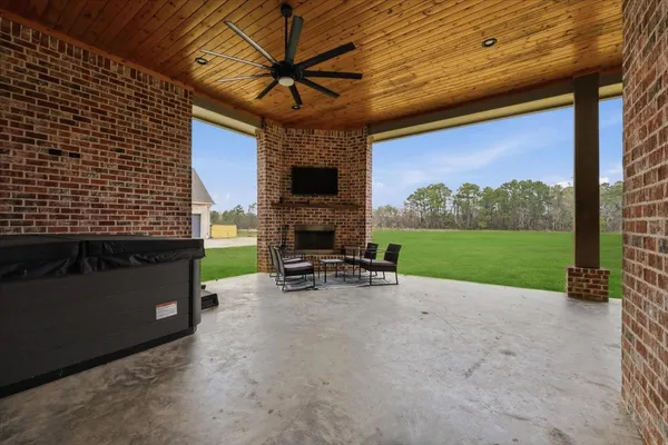 a view of a back yard of the house with green space