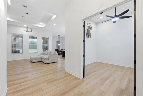 a view of livingroom with furniture and workspace