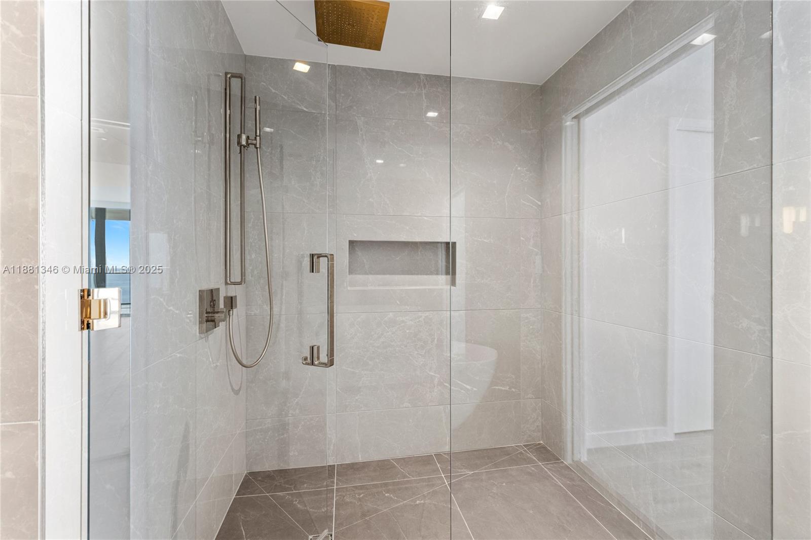 1116 North Ocean Boulevard, Unit 1404 Pompano Beach, FL 33062 - Photo 31 of 80 a bathroom with a shower