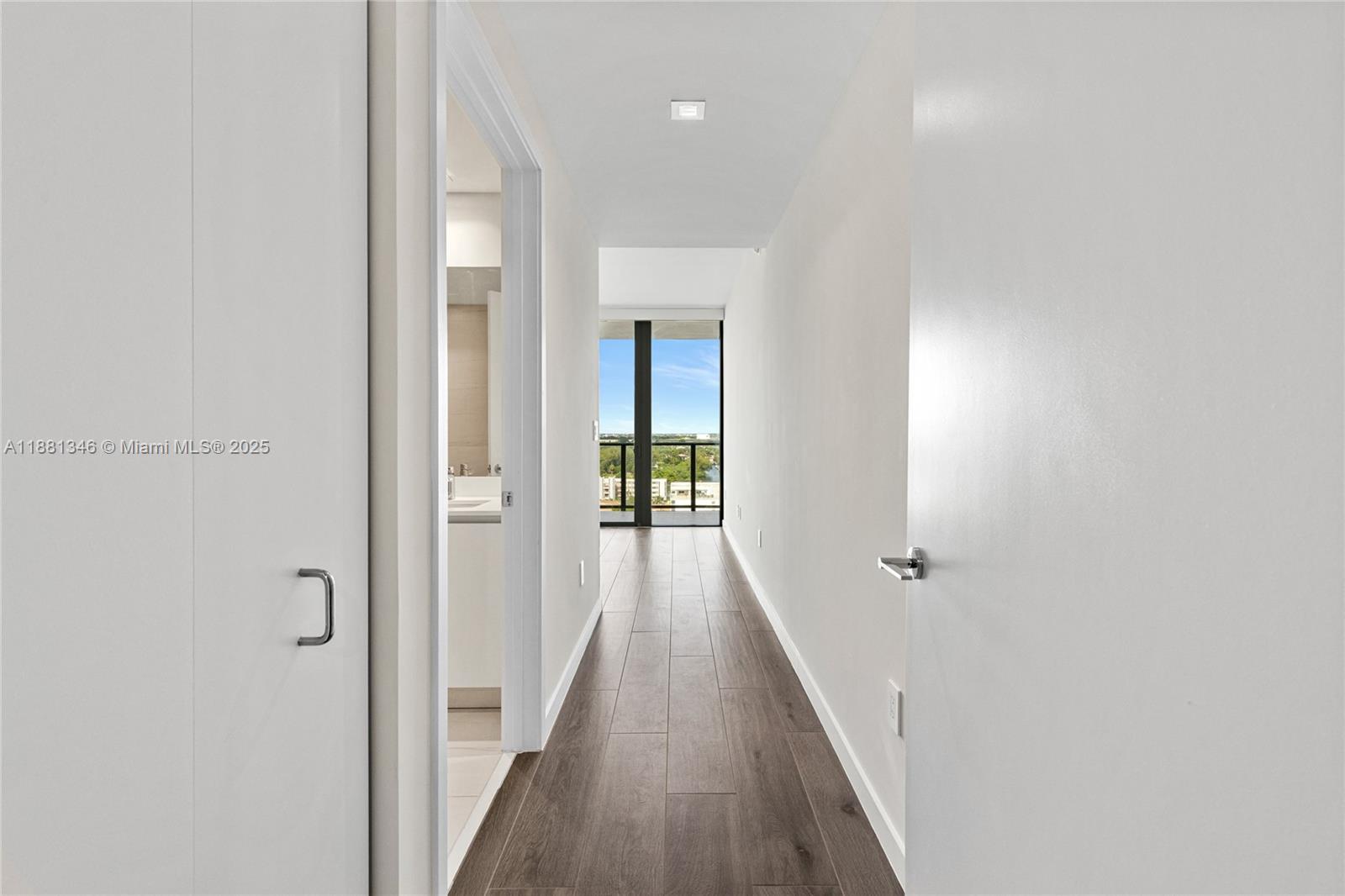 1116 North Ocean Boulevard, Unit 1404 Pompano Beach, FL 33062 - Photo 43 of 80 a view of a hallway with wooden floor
