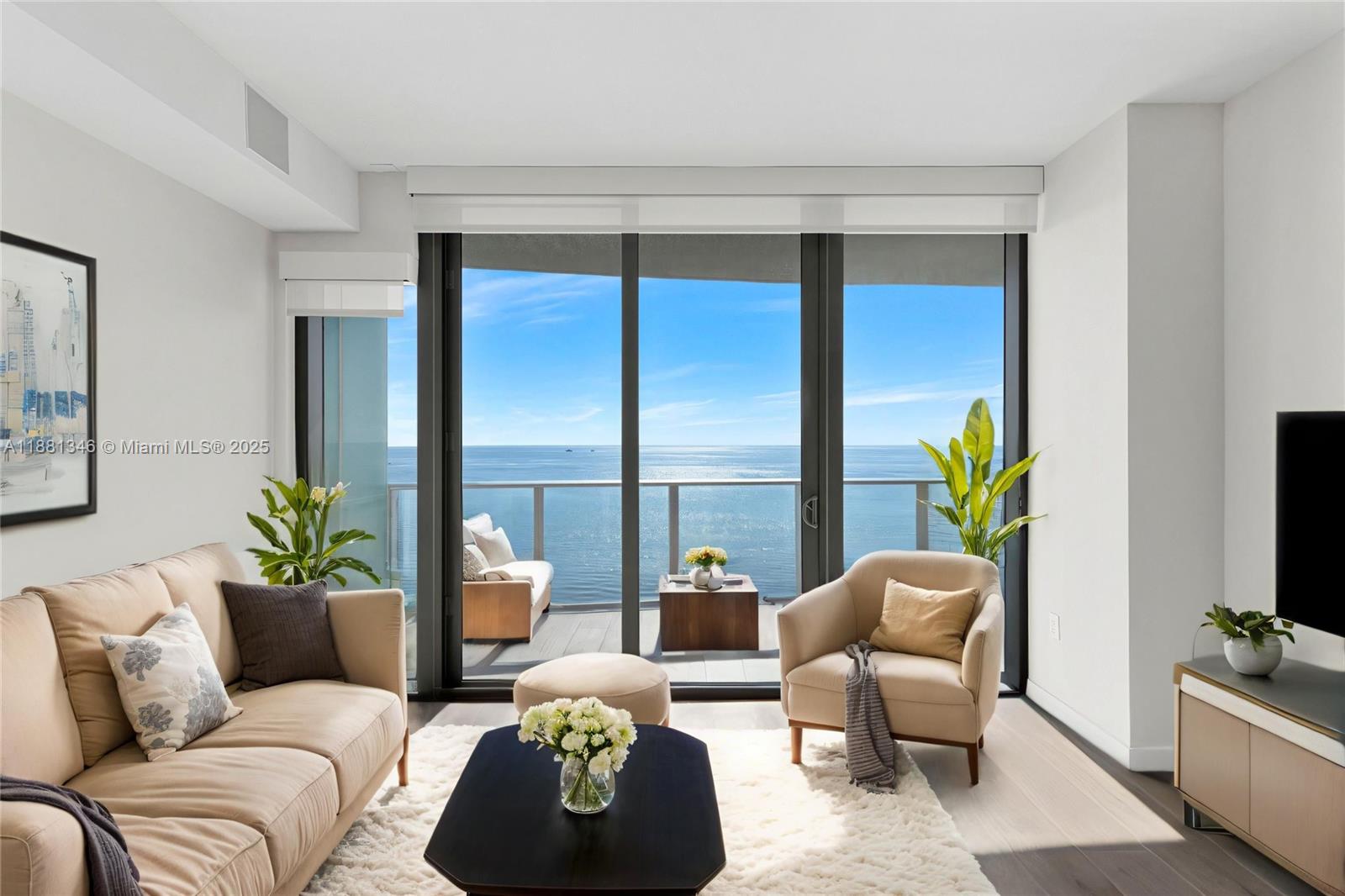 1116 North Ocean Boulevard, Unit 1404 Pompano Beach, FL 33062 - Photo 76 of 80 a living room with furniture and a potted plant