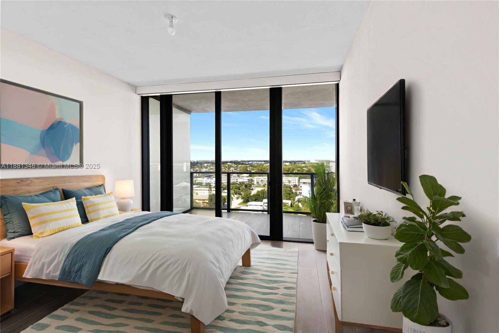 1116 North Ocean Boulevard, Unit 1404 Pompano Beach, FL 33062 - Photo 78 of 80 a bedroom with a large bed and a large window