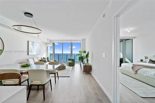 a spacious bedroom with two beds and large window
