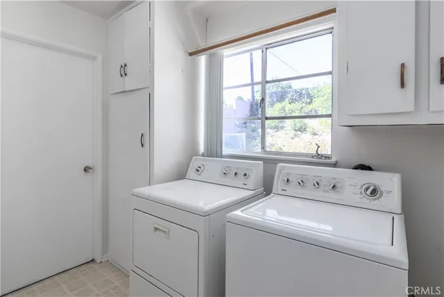 a view of a dining room with furniture and front door
