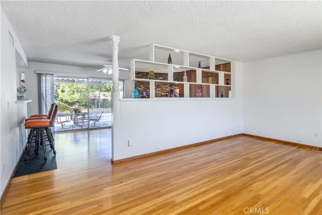 a view of livingroom with furniture wooden floor and windows