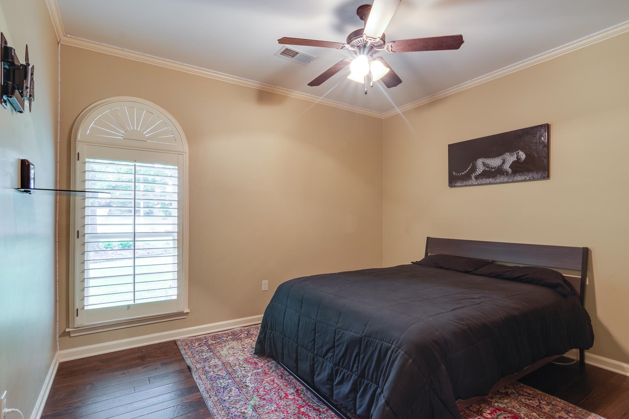 791 North Tree Drive Collierville, TN 38017 - Photo 16 of 27 Room featuring wood-finish flooring, a ceiling fan with light, and crown molding