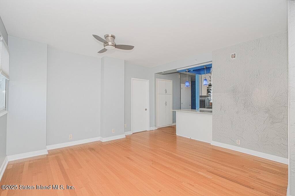 130 Beach 119th Street, Unit 3B Queens, NY 11694 - Photo 13 of 29 a view of a room with a ceiling fan