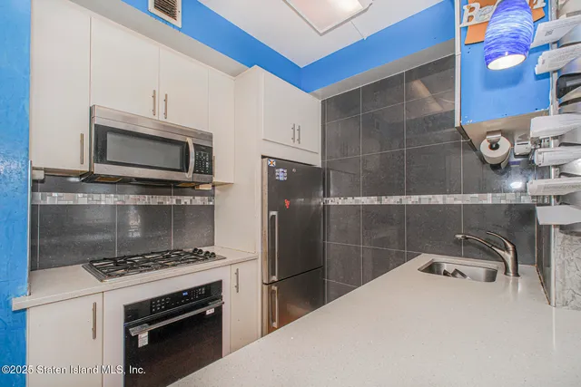 a kitchen with a stove and a microwave