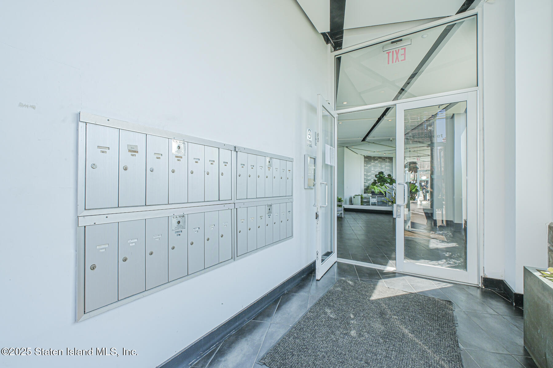 130 Beach 119th Street, Unit 3B Queens, NY 11694 - Photo 5 of 29 a view of an entryway with wooden floor
