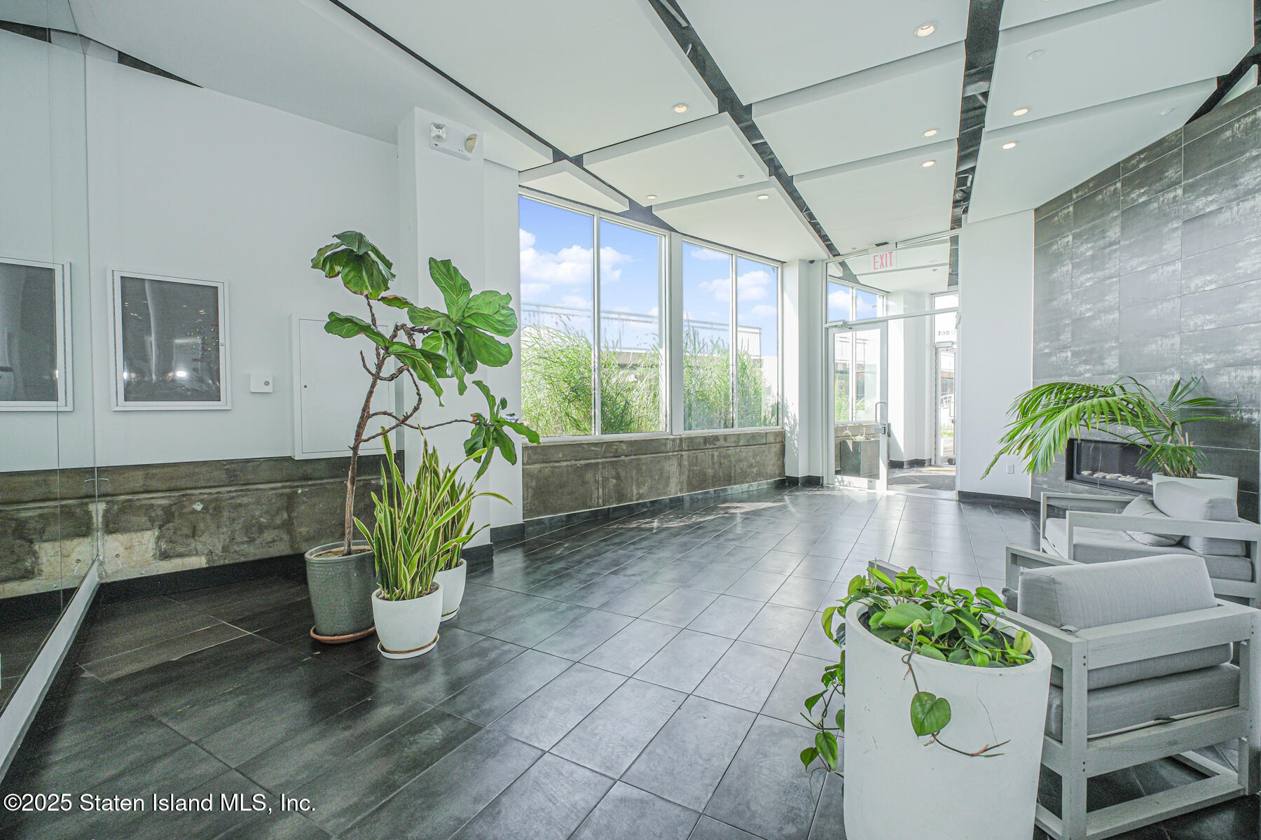 130 Beach 119th Street, Unit 3B Queens, NY 11694 - Photo 7 of 29 a view of living room filled with furniture and a potted plant
