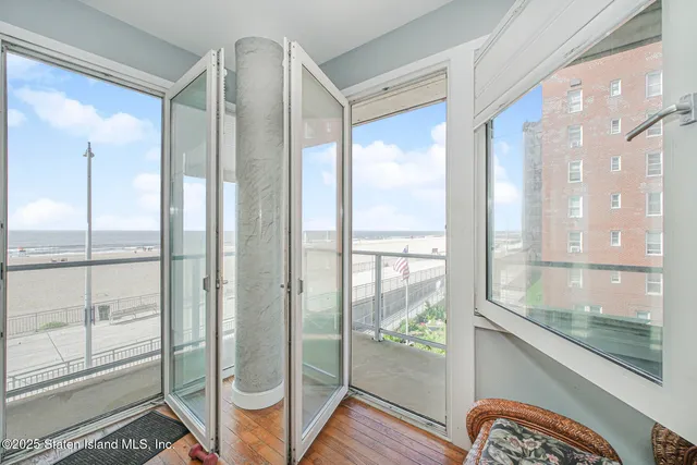 a bathroom with a glass shower door and mirror