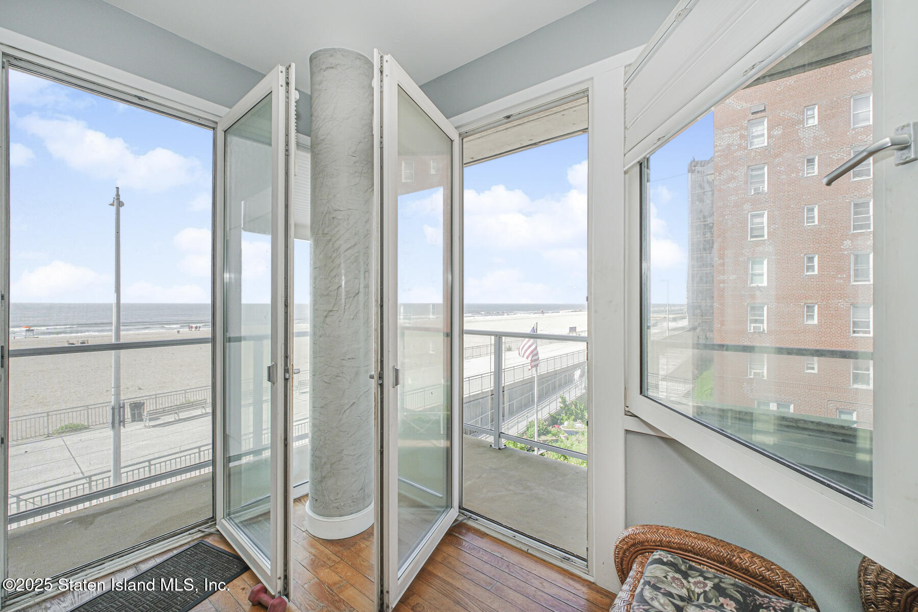 130 Beach 119th Street, Unit 3B Queens, NY 11694 - Photo 8 of 29 a bathroom with a glass shower door and mirror