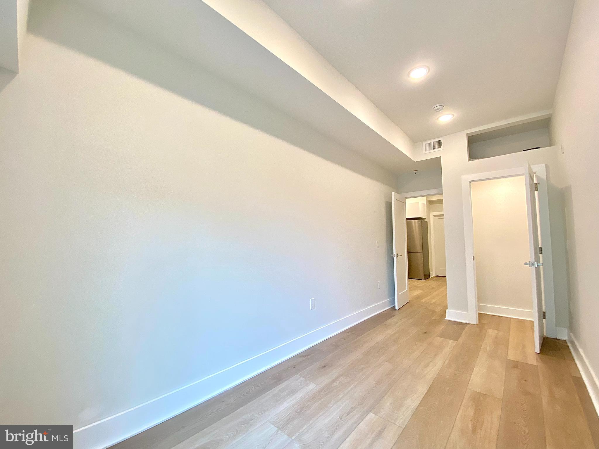 2216 Walnut Street, Unit 401 Philadelphia, PA 19103 - Photo 11 of 20 a view of hallway with wooden floor
